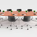 Round Wooden Conference Table With Black Office Chairs Notebooks And Small Plants