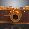 Vintage Classic Camera With Gold Metal Knobs Leather Body And Round Lens