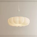 Modern White Petal Shaped Pendant Light Hanging in Light Colored Wall Interior