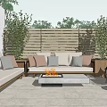 Cozy Outdoor Sofa With Fire Pit And Plants On Patio With Wooden Fence