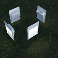 Four White Outdoor Lights Illuminated Arranged In A Circle On Grass