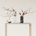 White and Black Vases with Red Berry Branches on Wooden Table with Small Bird Decor