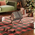 Cozy Living Room Decor With Green Sofa Christmas Gifts Plaid Rug And Magazine Rack