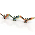 Three Colorful Bird Figurines With Red Blue Yellow Wings Standing On White Background