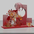Creative Red Art Installation With Curved Structures Circular Frame And Floral Decorations On Geometric Base