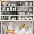 Organized Shelves With Stylish White Ceramic Kitchenware Plates Cups Pitchers And Cooking Utensils