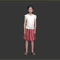 Little Girl Standing in White Top and Red Plaid Skirt on Gray Background with Sandals