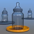 Glass Baby Bottles with Blue Caps on Yellow and Blue Trays for Baby Daily Use