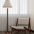Brown White Leisure Chair With Wooden Frame Woven Design And Floor Lamp By Curtains