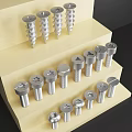 Various Types of Hardware Tools Screws and Bolts Arranged on Layered Display Stand