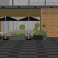 Modern Cafe Outdoor Seating Area With Glass Facade Brick Wall Black Umbrellas And Green Plants