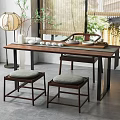 Chinese Style Wooden Tea Table And Padded Stools With Lantern And Green Plants