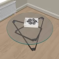 Round Glass Top Coffee Table With Black Metal Base And Modern Design Book
