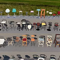 Assorted Bar Stools Displayed On Tiered Platform With Various Colors And Designs 3d model