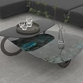 Modern Coffee Table With Blue Marble Top Black Tray Glasses Green Plant And Gray Sofa
