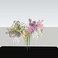 Floral Installation Featuring Purple Pink Flowers Green Vines Curved Metal Frame Blue Sky Black Platform