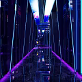 Modern KTV Corridor With Purple Blue Lighting Mirror Walls And Reflective Floor