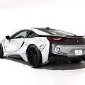 White Sports Car With Sleek Aerodynamic Design And Black Alloy Wheels