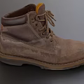Brown Leather Work Boots With Worn Muddy Surface Thick Sole And Round Toe Laces
