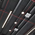 Modern Industrial Suspended Ceiling With Black Metal Framing Red Accent Lines And Recessed Linear Lights
