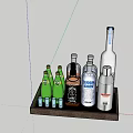 Various Alcohol Bottles And Green Shot Glasses On Wooden Tray For Home Bar Setup