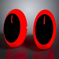 Two Red Circular Electronic Appliances With Sleek Black Front Panel Design