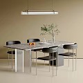 Modern Marble Dining Table With Black Chairs Green Plant Oranges And Ceiling Light