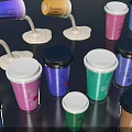 Colorful Coffee Cups With Different Lids And Various Designs On Table 3d model