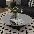 Black Base Round Glass Coffee Table with Vase White Flowers Magazine on Geometric Rug