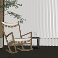 Wooden Rocking Chair With White Cushion And Side Table Vase Green Plant Against White Blinds