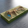 Commercial Equipment 3D Terrain Model With Green Base Brown Mountains And Blue Lakes