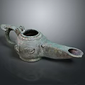 Ancient Style Bronze Oil Lamp With Decorative Handle And Intricate Design