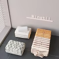 Stacked Bed Linens with White Beige Striped and Green Geometric Patterns Near Window Blinds