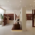 Modern Clothing Store Interior With Reception Desk Pendant Light Green Plants And Display Shelves