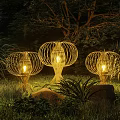 Woven Lantern Shaped Outdoor Lights Illuminating Nighttime Garden With Plants And Trees