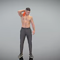 A Shirtless Man Wiping Shoulder With Orange Cloth In Dark Pants And Black Shoes