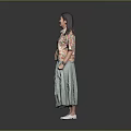 A Woman Wearing Floral Shirt And Green Skirt Standing On Gray Background