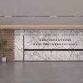 Modern Reception Desk In Spacious Lobby With Marble Wall And Decorative Plant