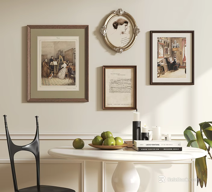 Framed Artworks On Wall With White Round Table Green Apples Books And Black Chair 3d model 