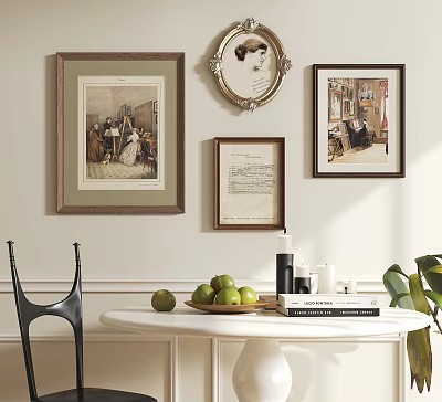 Framed Artworks On Wall With White Round Table Green Apples Books And Black Chair 3d model