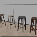 Modern Interior Featuring Four Different Wooden Bar Stools With Light Wall And Herringbone Floor