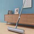 Efficient Cleaning Mop for Home Use in Living Room with Wooden Floor and Sofa Furniture
