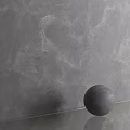 Gray Textured Wall Component With Black Sphere On Transparent Surface