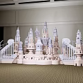 Detailed Castle Model Featuring Towers Wing like Structures and Railings in Indoor Space