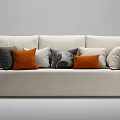 Three Seater Beige Sofa with Black Armrests and Orange Grey White Patterned Accent Pillows