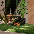 Forest Themed Photo Spot With Green Backdrop Floral Arch White Chandeliers And Green Plants