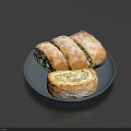 Sliced Stuffed Bread On Black Plate With Golden Crust And Fresh Filling
