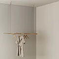 Wooden Hanger Ceiling Hung With Gray Robe and Empty Hangers Against Light Gray Walls