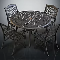 Round Metal Outdoor Table With Four Intricate Cutout Design Chairs For Patio Garden Use