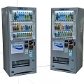 Public Facility Two Stainless Steel Vending Machines Dispensing Various Beverages